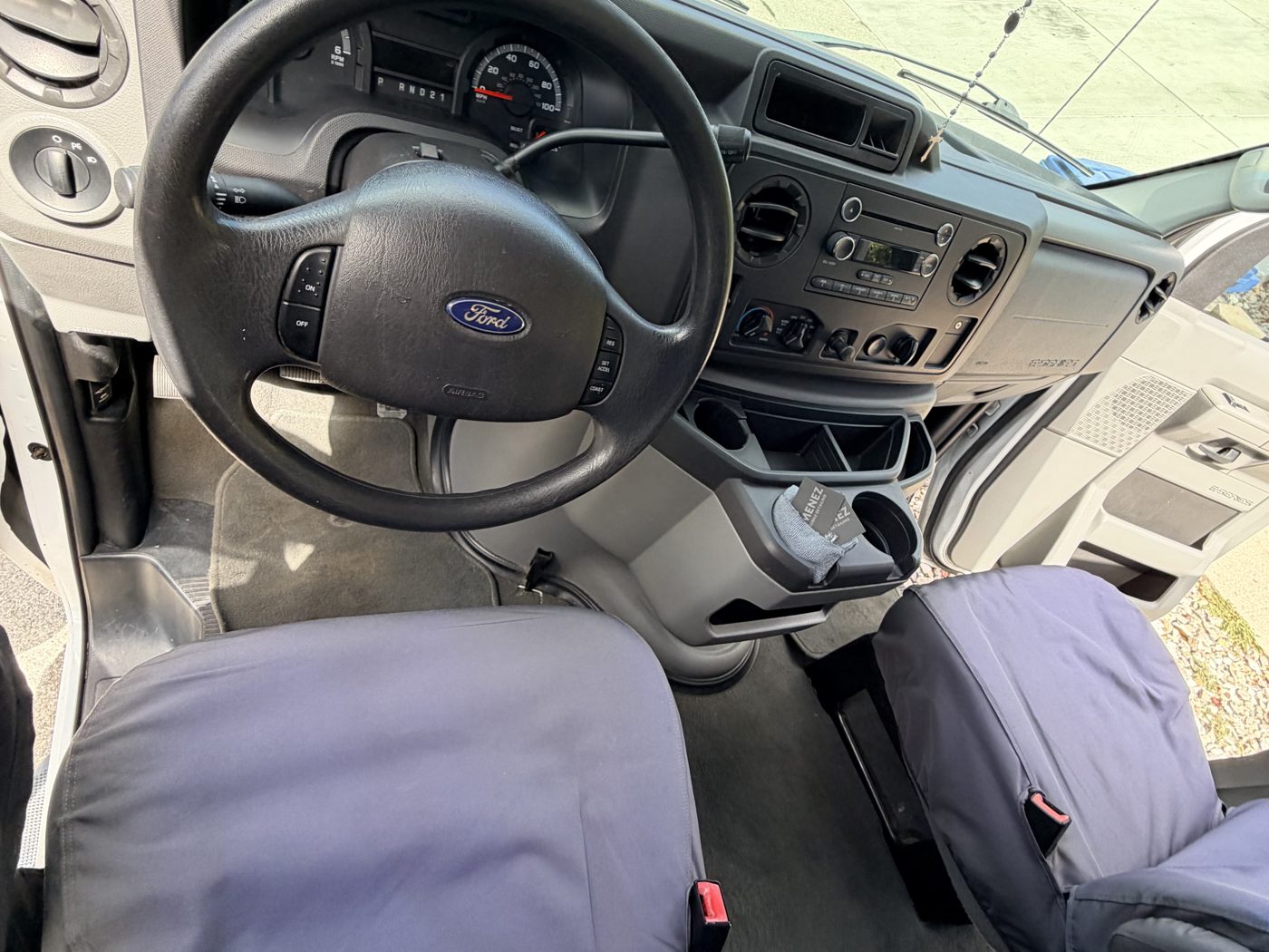 Van interior after detailing, clean console and fresh seat covers