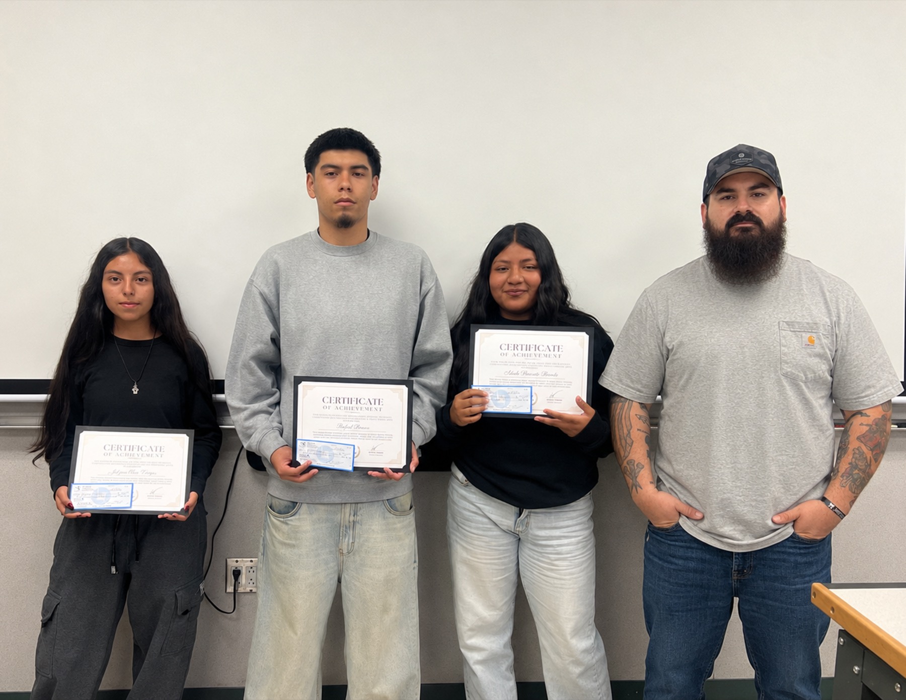 Alfredo Jimenez with three Pioneer Valley High School Digital Arts students holding their scholarship certificates